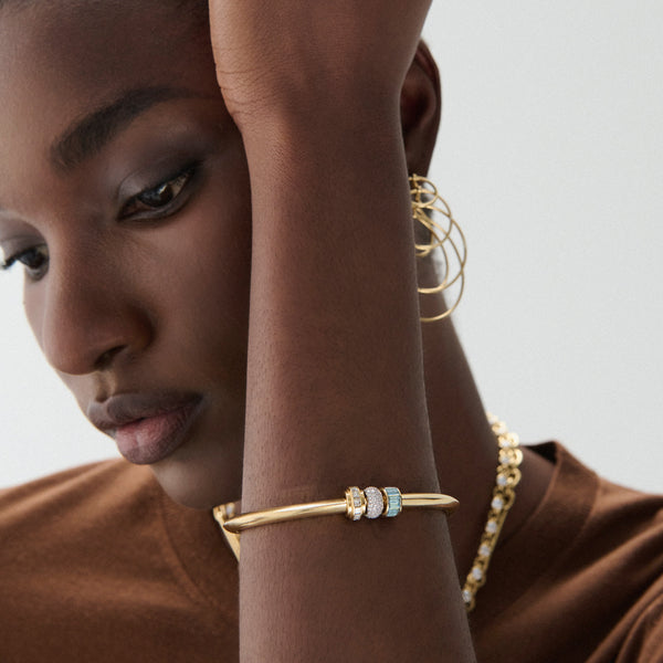 True Love | Pavé Orbit and Baguette Strong Heart Bangle | Diamonds, Aquamarine, Mixed Gold